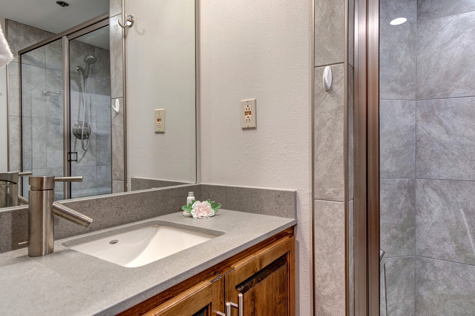 Shared Full Bathroom with tile & glass shower