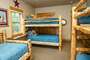 Two log Bunk beds and a Log Day bed with Trundle