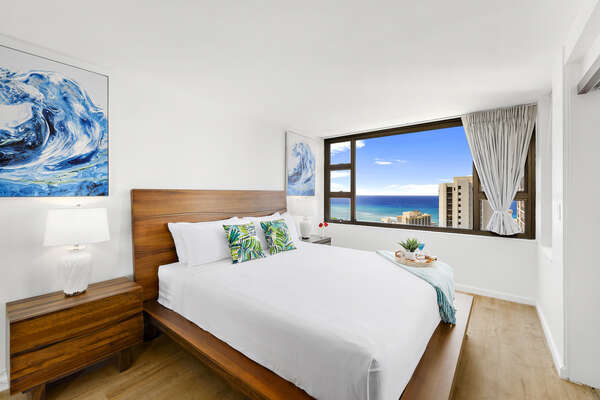 Relax in your bedroom with a king-size bed and a beautiful ocean view.