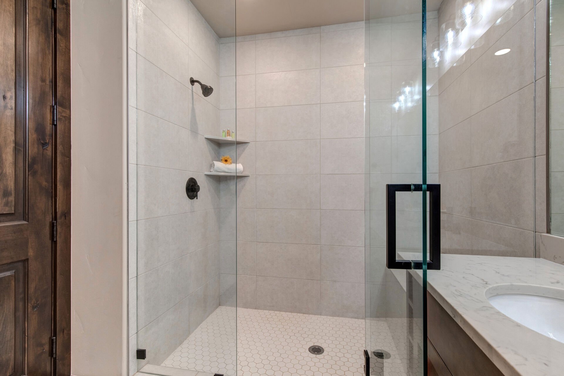 Master Bath with a Tile / Glass Shower