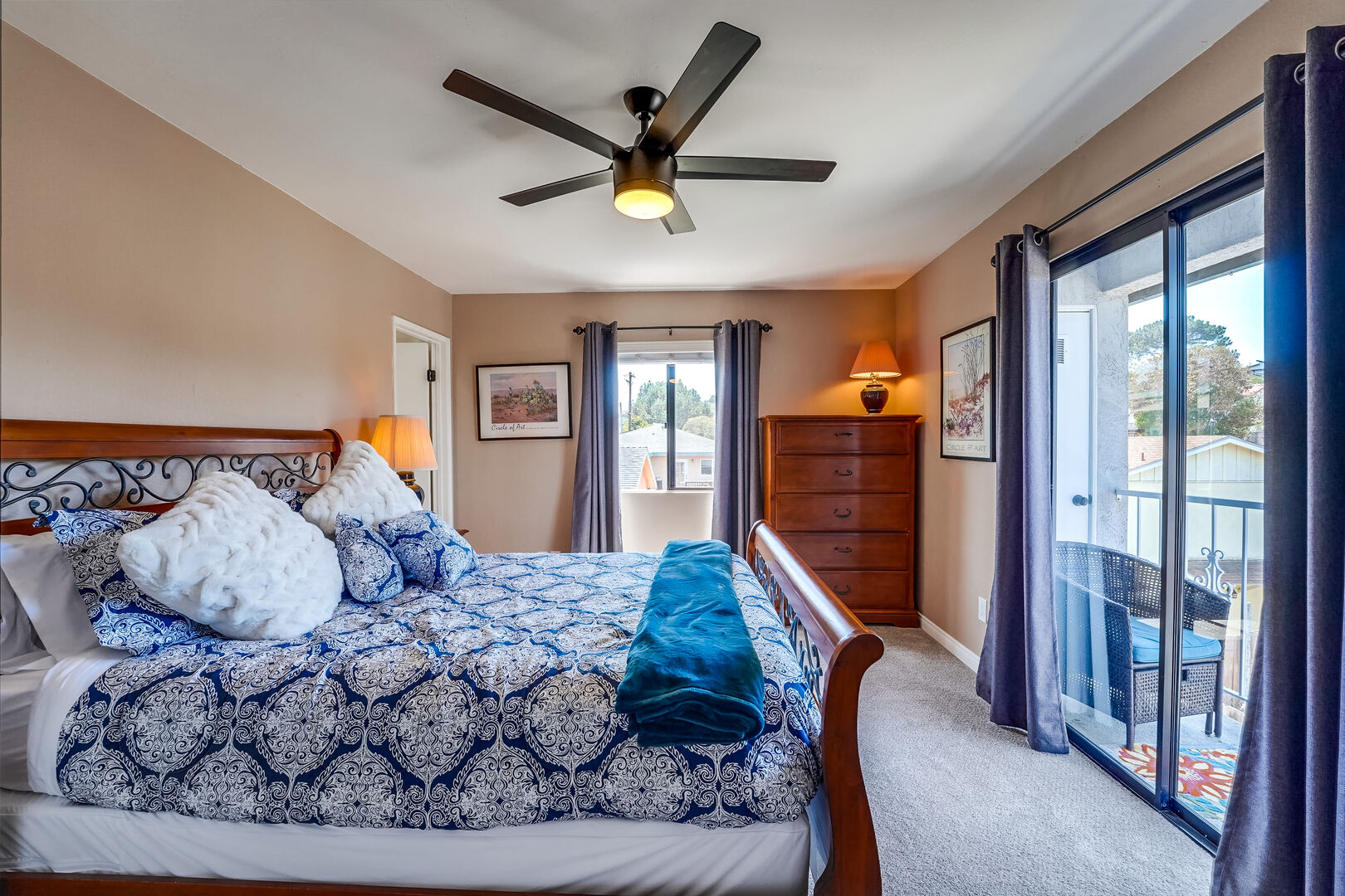 Upstairs master bedroom with queen size bed, in-suite full bathroom, ample dresser and closet space, remote-controlled ceiling fan and light. Small balcony with sometimes strong, refreshing coastal breeze