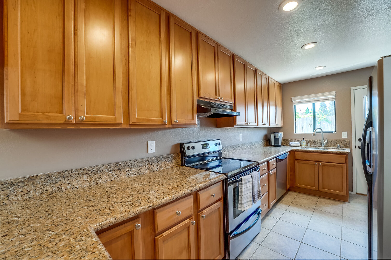 Kitchen is fully equipped to make meals at home. Dishwasher, stove, oven, microwave, large refrigerator, standard and Keurig coffee makers and adequate cook and dishware provided