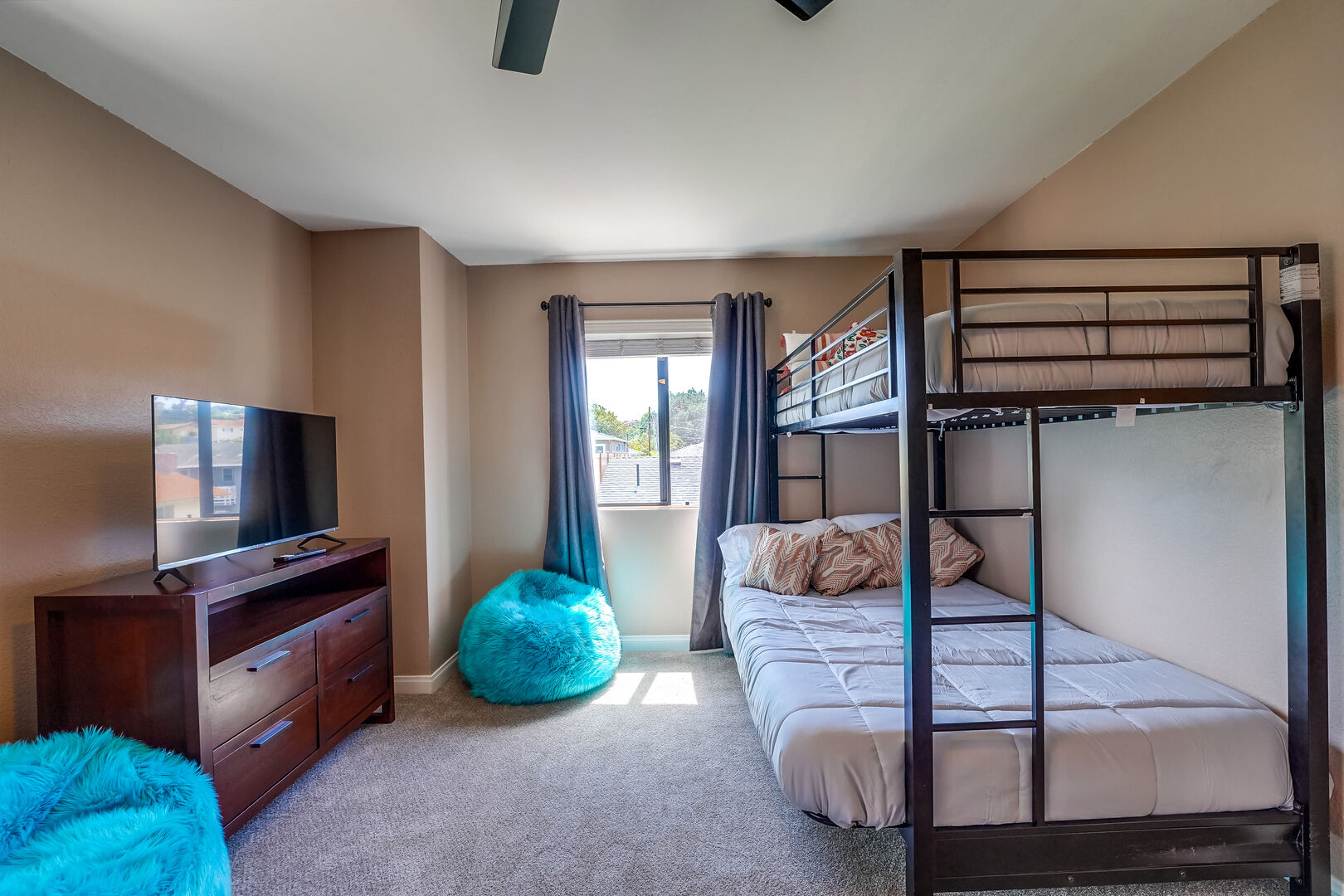 Upstairs guest bedroom with full size bottom bunk and twin size top bunk beds