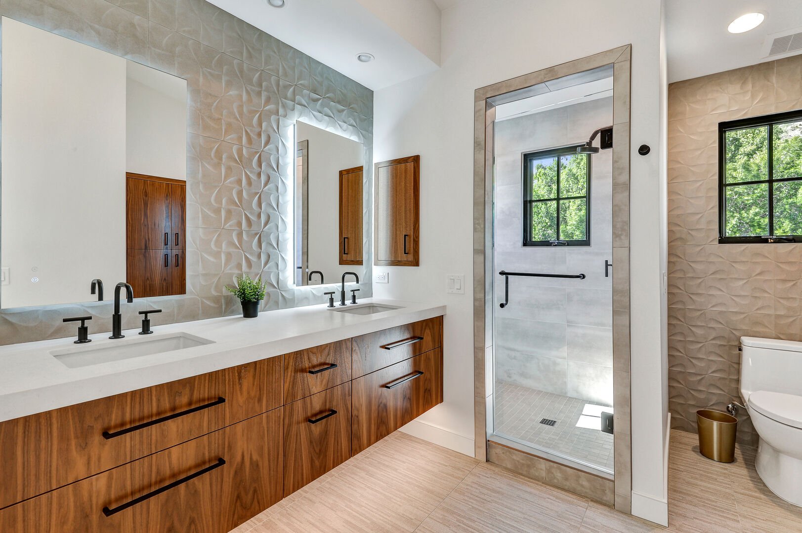 The en suite bathroom of the upstairs Bedroom 2 offers a well-appointed and private space, combining modern amenities with comfort for a luxurious experience.