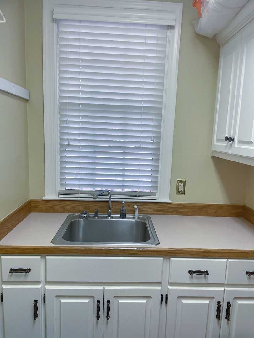 sink and tons of storage in Laundry room