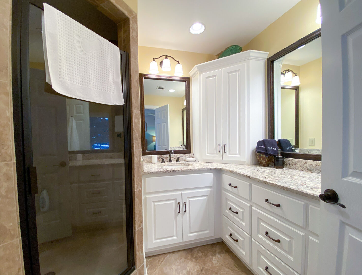 double vanity, walk in shower with seating and more gorgeous lake views