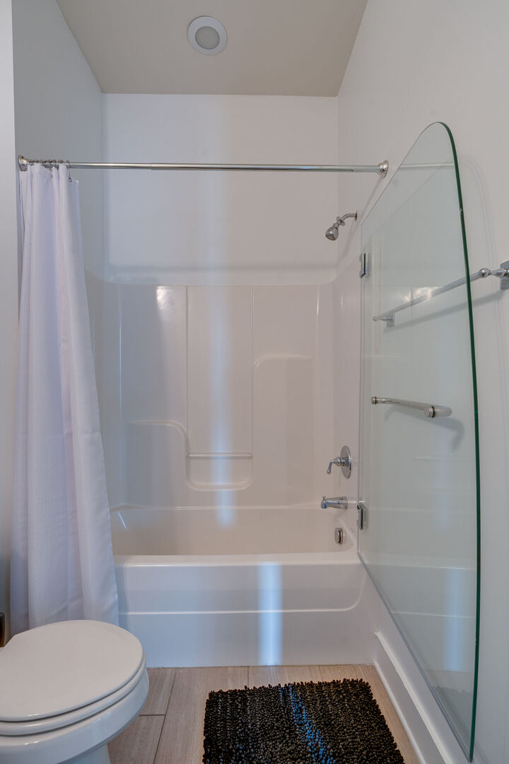Unit 3: Bathroom with a shower and tub combo.