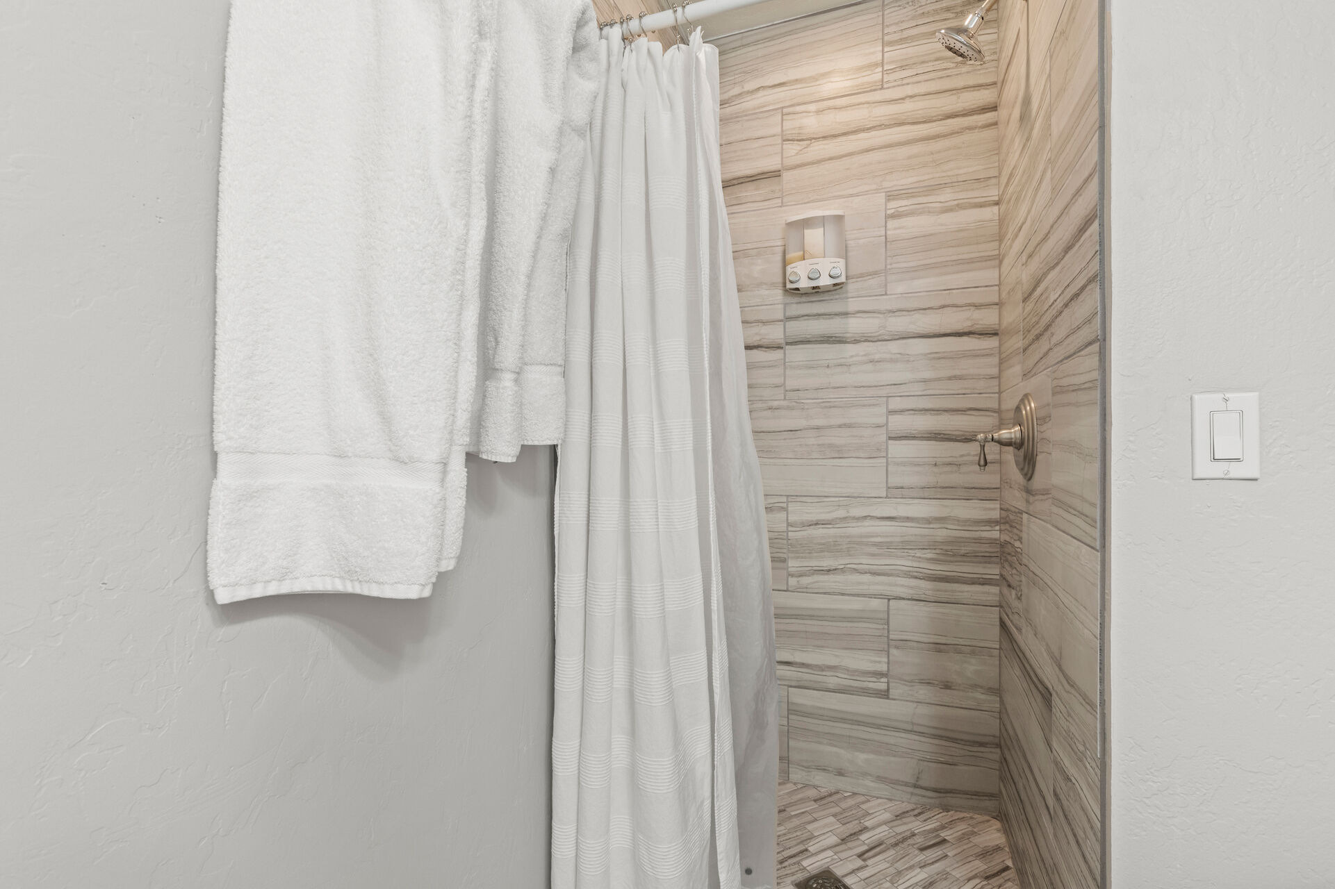 Shared Full Bathroom with tiled shower