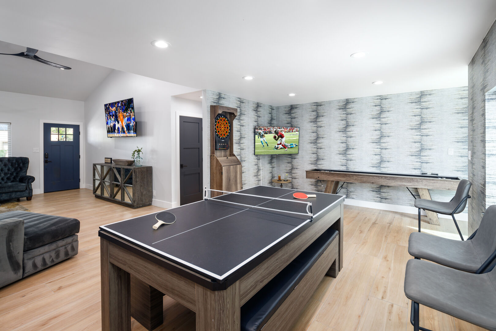 Formal dining area converts to game room! Table can be changed to pool table or ping-pong! Also features shuffle board, smart TV, and dart board!