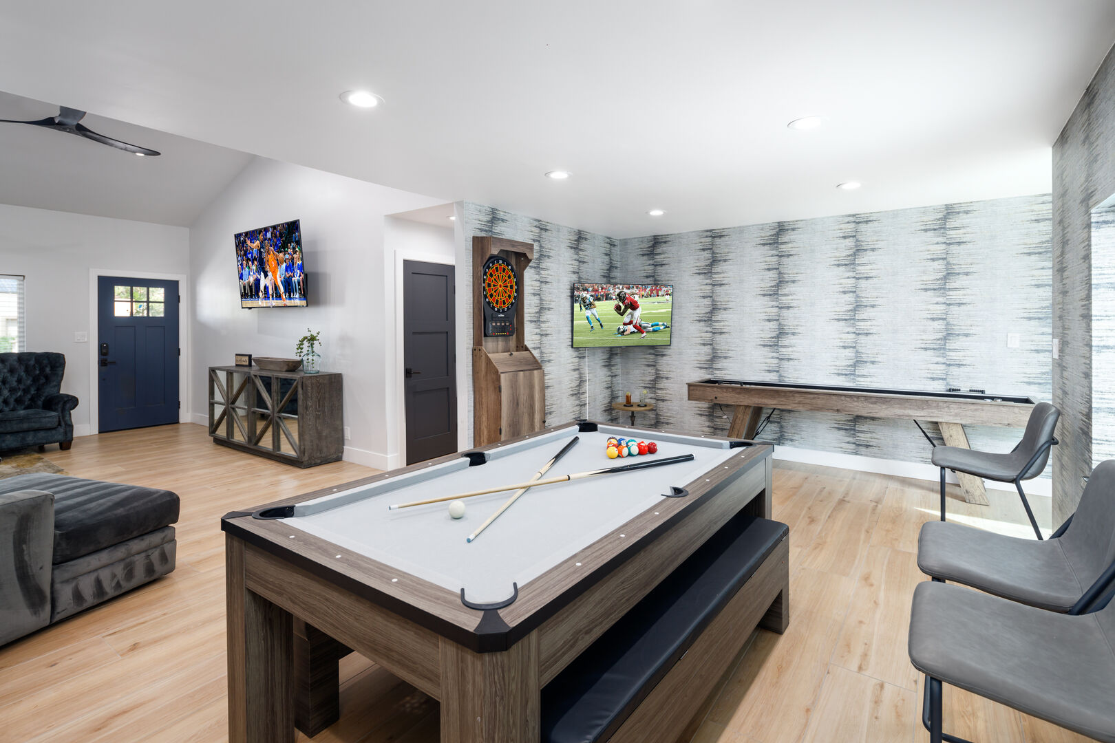 Formal dining area converts to game room! Table can be changed to pool table or ping-pong! Also features shuffle board, smart TV, and dart board!