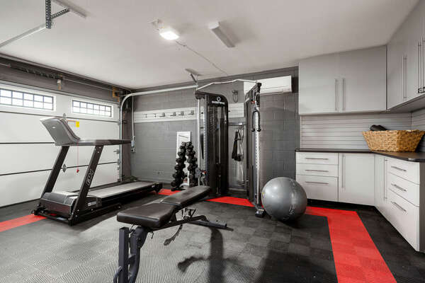 Stay fit in the garage gym while staying at Vacation Vibes.