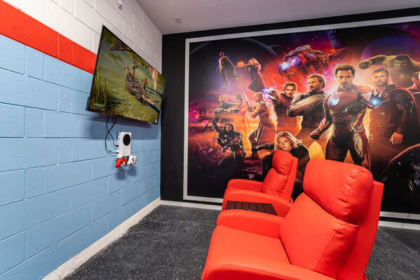 Games room with theater seating showing tv and xbox