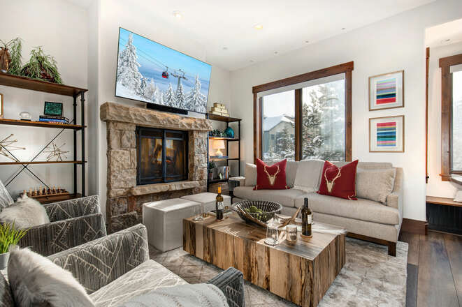 Mountain contemporary furnishings, a 65” Smart TV with cable programming and Sonos Soundbar, a cozy gas fireplace and a plethora a of natural light