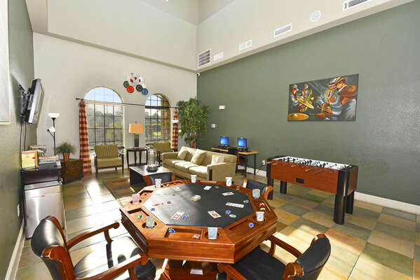 Games Room with poker table and foosball with TV