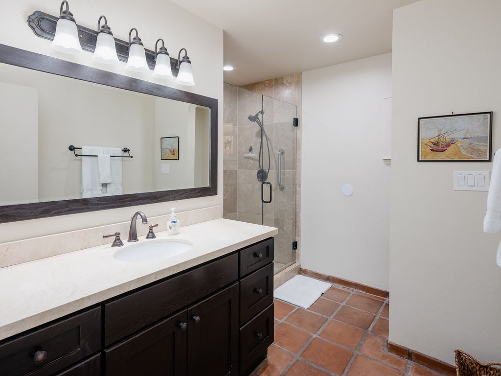 Hallway bathroom with large standing shower