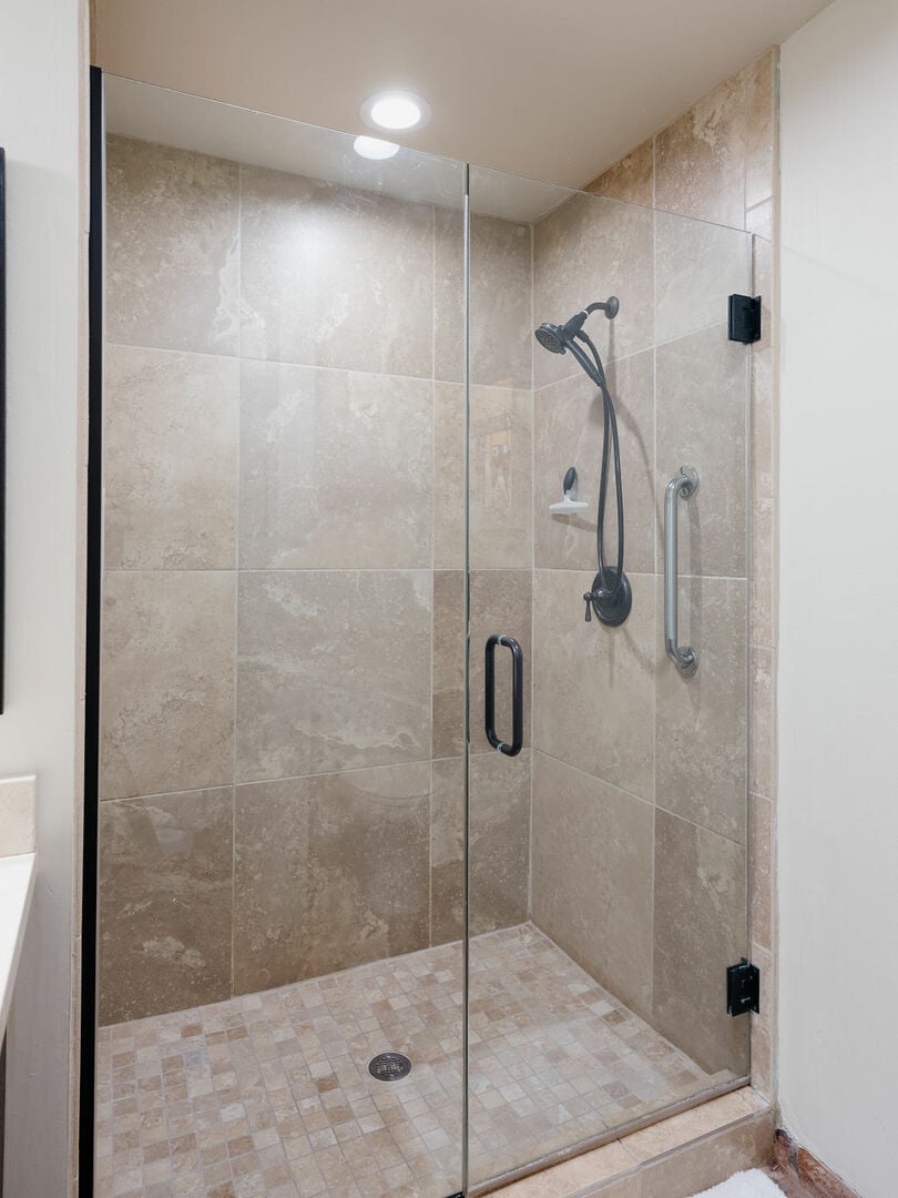 Hallway bathroom with large standing shower