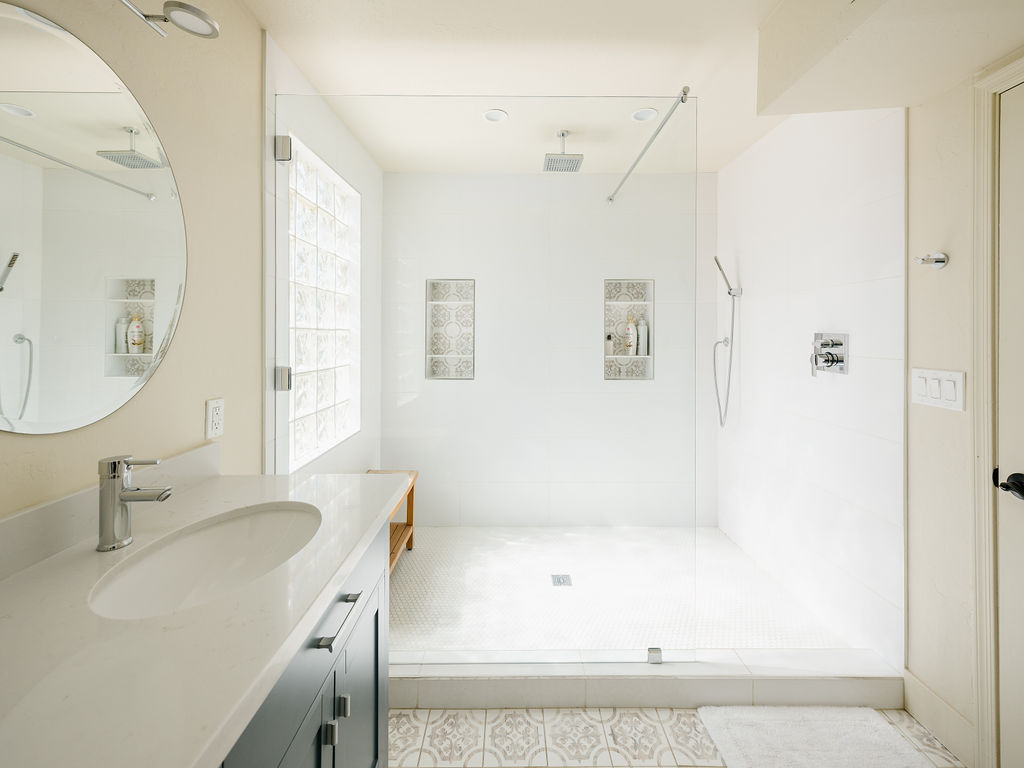 4th bedroom en-suite bathroom with dual vanity sink and large walk in shower
