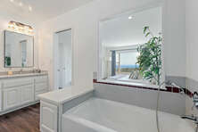 Primary bath tub with views.