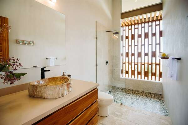 Spacious shower and bathroom between guests rooms.