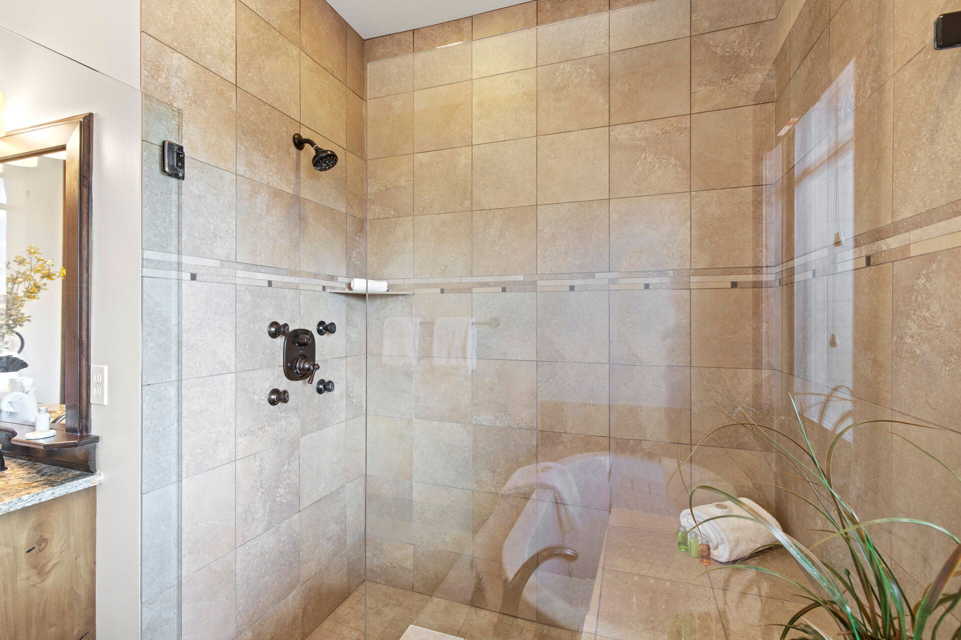 Master Bathroom with double sinks, jetted tub, and large tile and glass shower