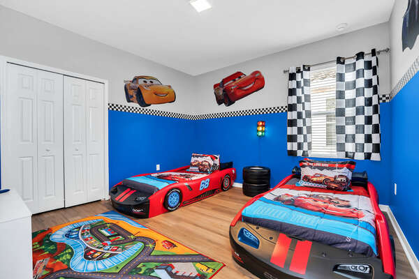 Vroom off in this kids room with 2x twin beds on the second floor.
