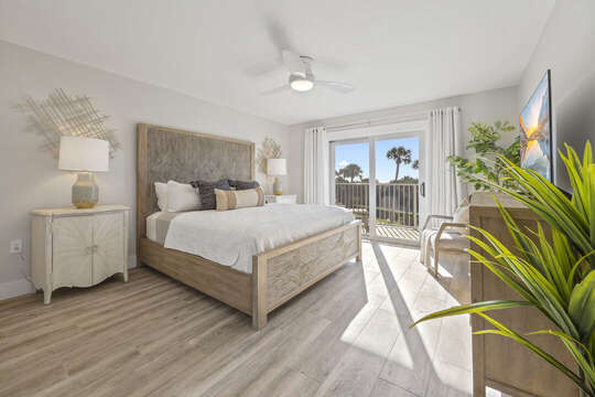 Beautiful master bedroom with direct balcony access and king bed