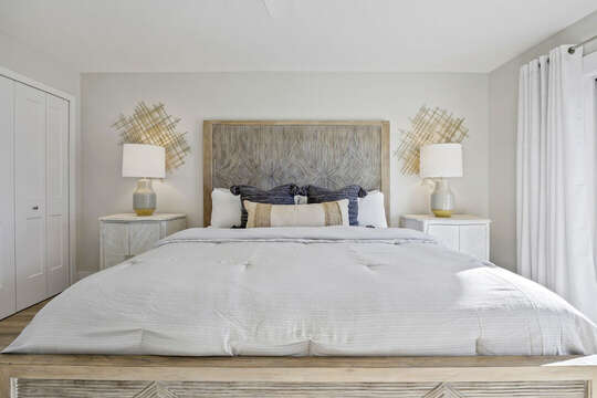 Master bedroom with plush king bed