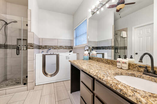 Master Bath with a Walk-in Therapeutic Tub and Shower