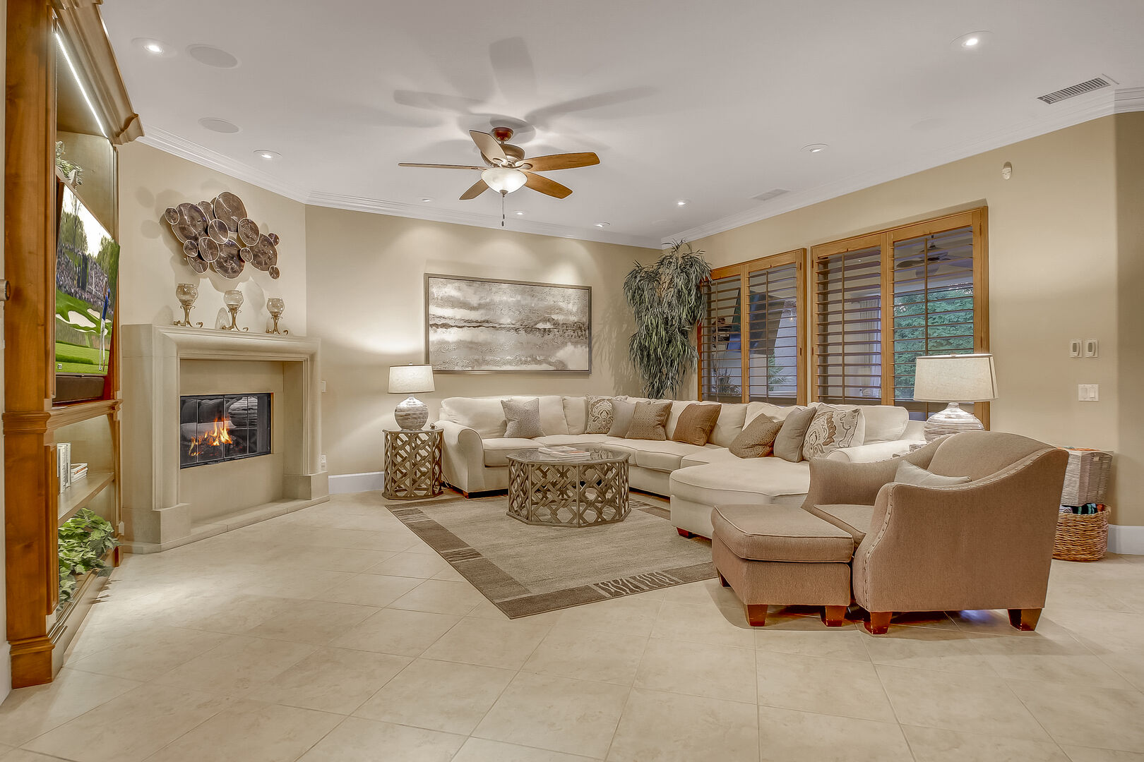 There is plenty of room in the living room to lounge in front of a 65-inch Samsung 4K Smart television and natural gas fireplace with comfort.