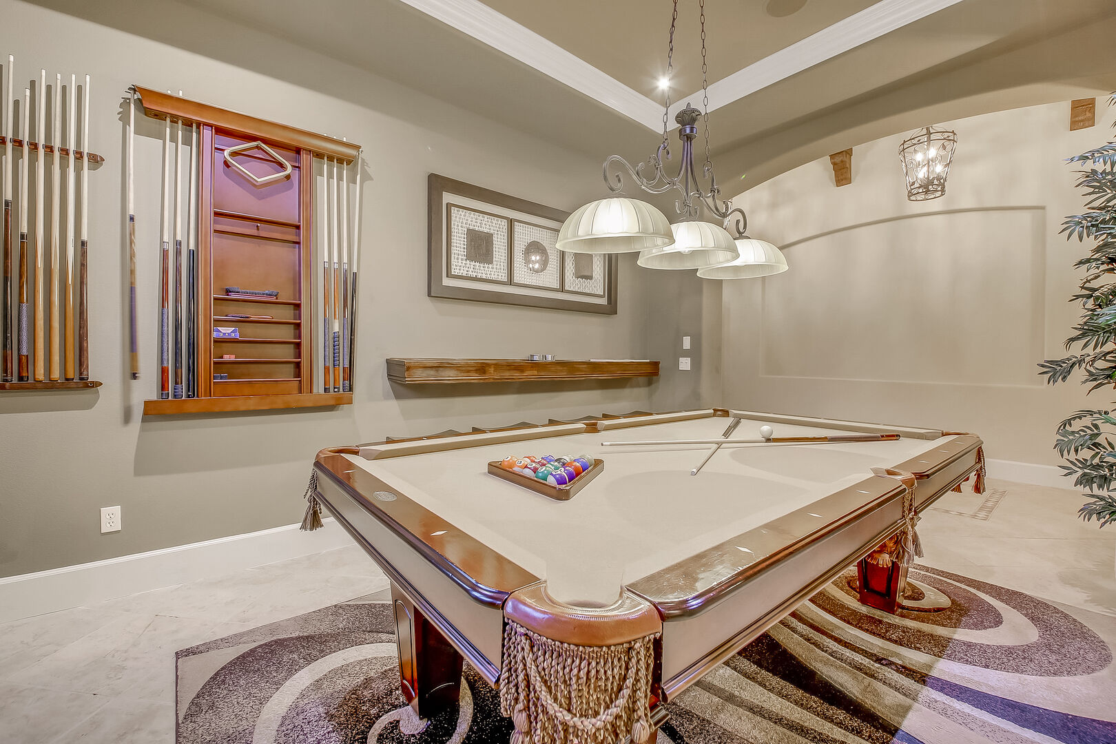 The pool table room just behind the kitchen features many pool cues to ensure you can all get involved in friendly fun!
