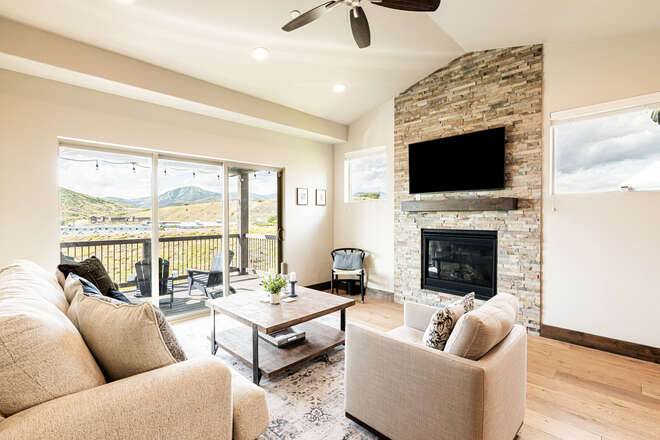 Main Level Living Room with a Gas Fireplace and Smart TV and Mountain Views