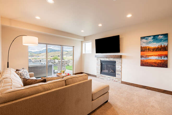 Lower Level Family Room with a Gas Fireplace, Smart TV and Ski Resort Views