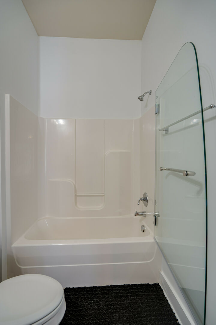 Full bathroom with shower and tub combo