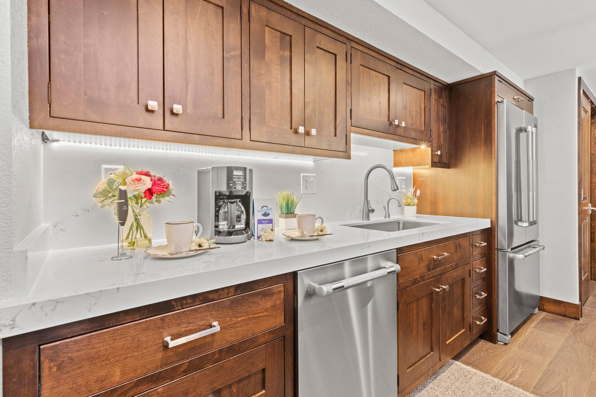 Fully Equipped Kitchen with beautiful stone countertops, stainless steel appliances, and ample space for any and all meal prep.
