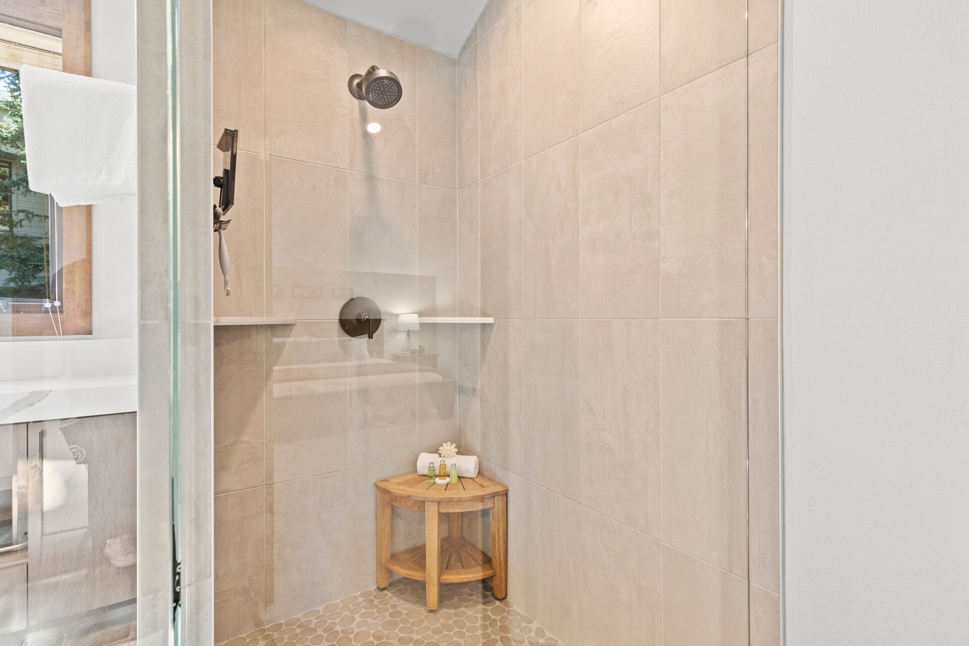 Master Bathroom with stunning wrap-around vanity and large tile and glass shower