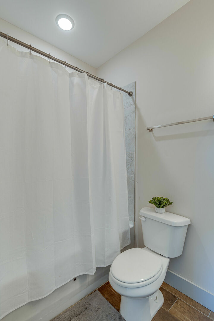 2nd Bedroom En-Suite Bathroom with shower/tub combo. (3rd Floor)