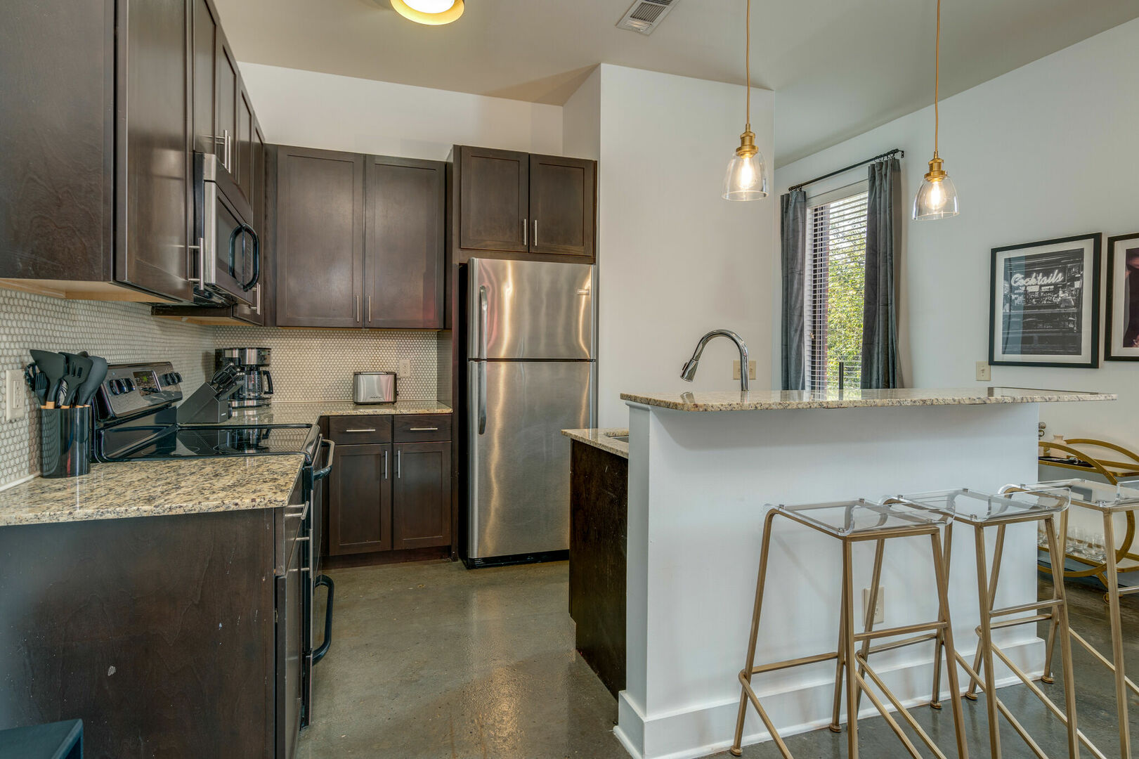 Fully equipped kitchen stocked with your basic cooking essentials. Complete with granite counter tops, stainless steel appliances, and breakfast bar seating.