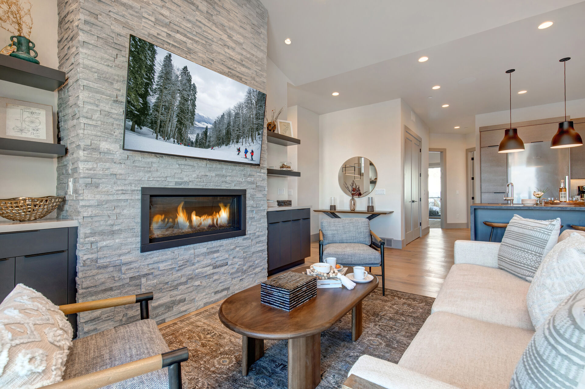 Main Level Living Room with a Gas Fireplace and Smart TV