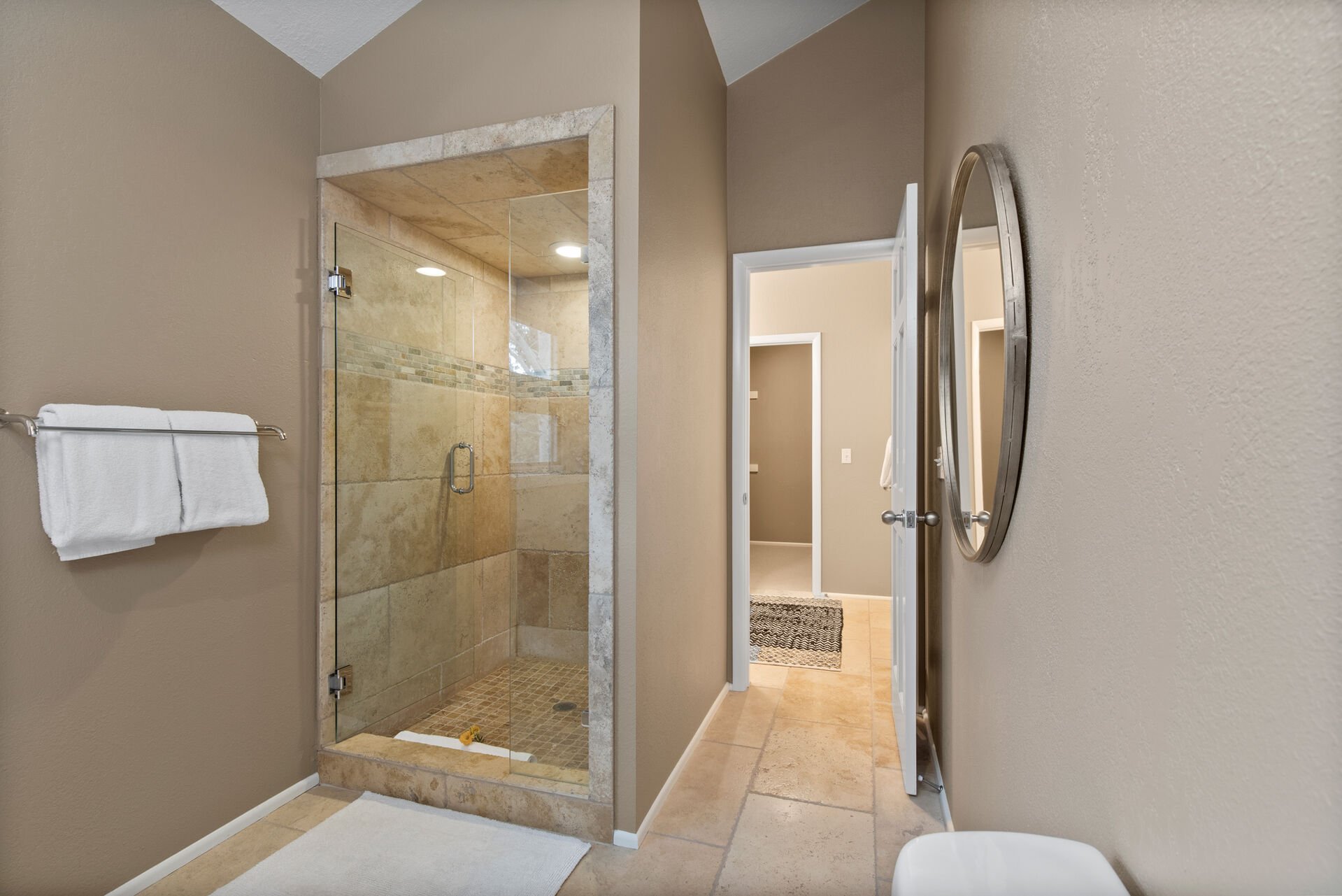 King size bed, walk-in closet, private balcony, and private bath with double sinks, tile shower and separate over-sized soaking tub