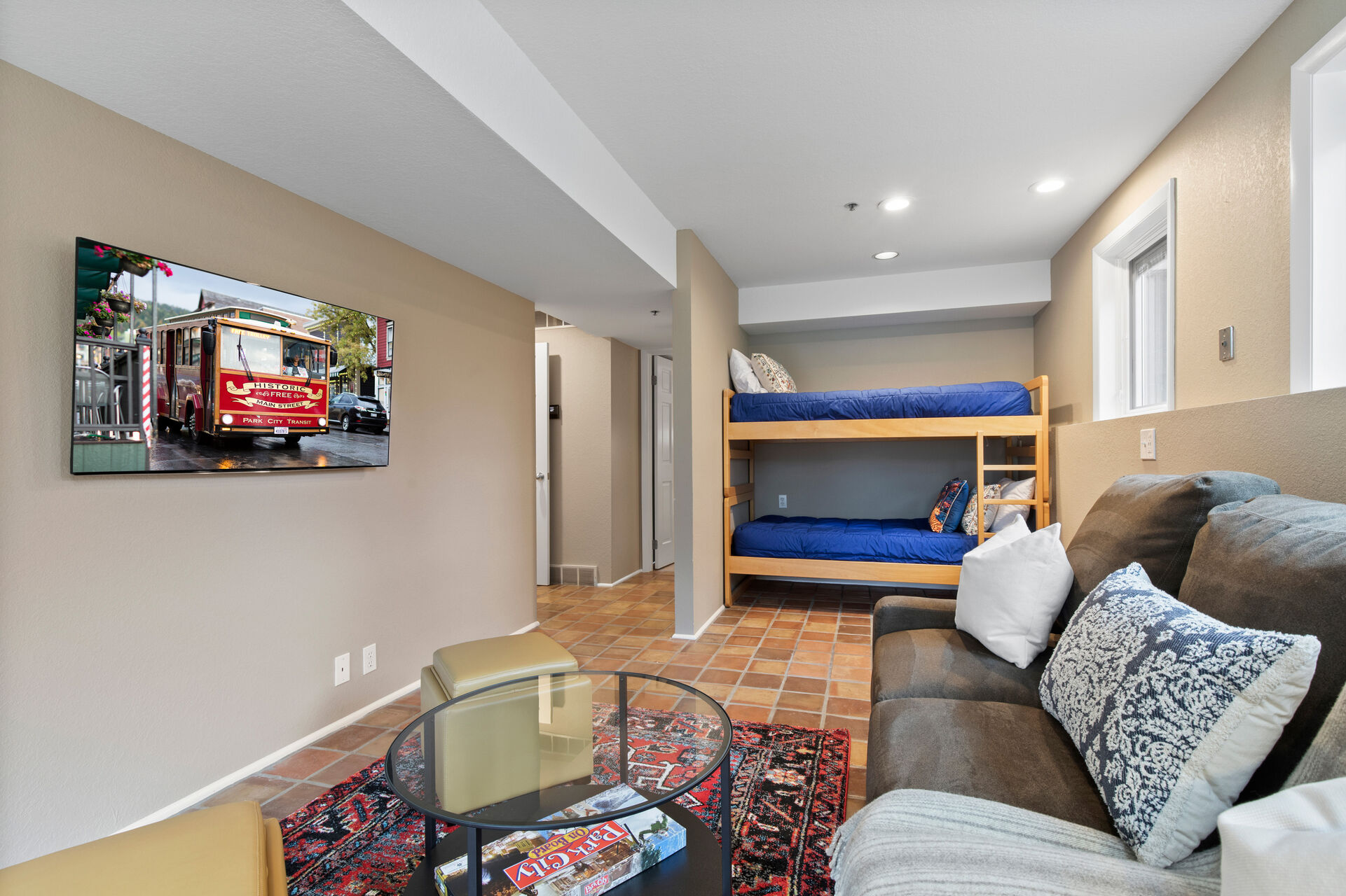 This room offers smart tv, queen size sofa bed, and twin over twin bunk bed
