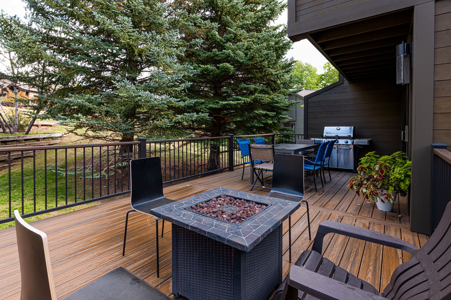 Private deck with a fire pit table