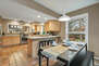 Fully equipped gourmet kitchen  bar seating for four, and access to the homes private back yard