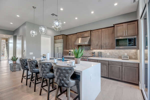 Gourmet Kitchen with a Large Center Island and Seating for Four