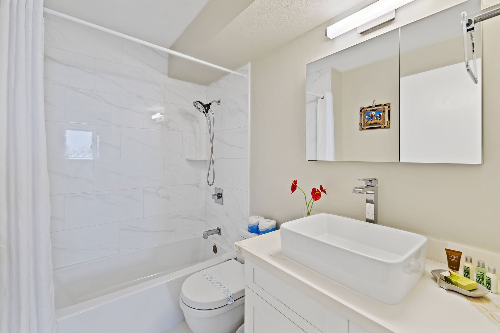 Full bathroom with tub and shower combo