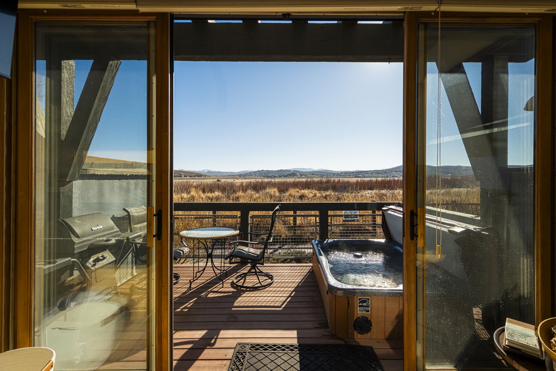 Deck with private hot tub and view of nature preserve Deck with private hot tub and view of nature preserve