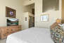 Master Bedroom with king bed, smart tv, electric fireplace, private balcony, and en suite bath