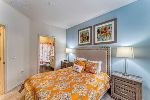 Bedroom 2 with queen bed showing en-suite bath