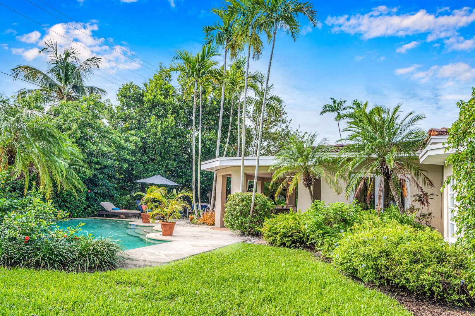 This private tropical oasis is a hidden gem with its heated pool amidst the lush courtyard.