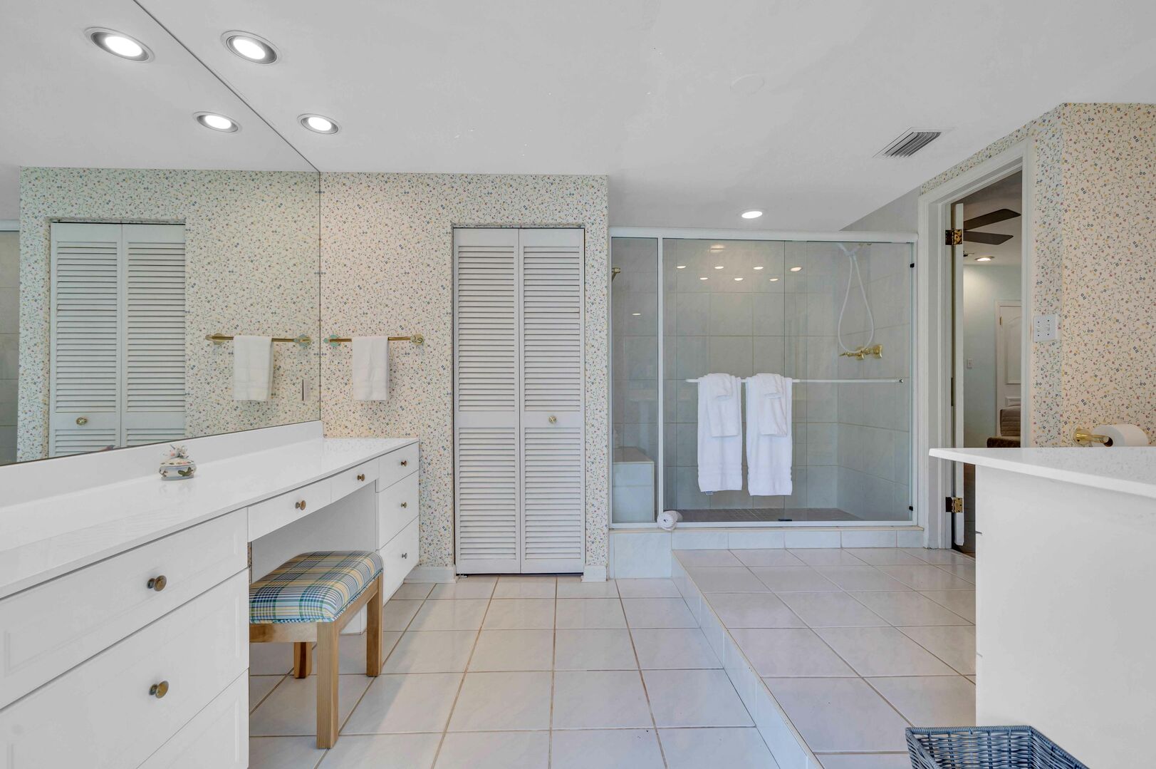 The oversized Master bathroom has a walk-in shower with separate makeup vanity area.