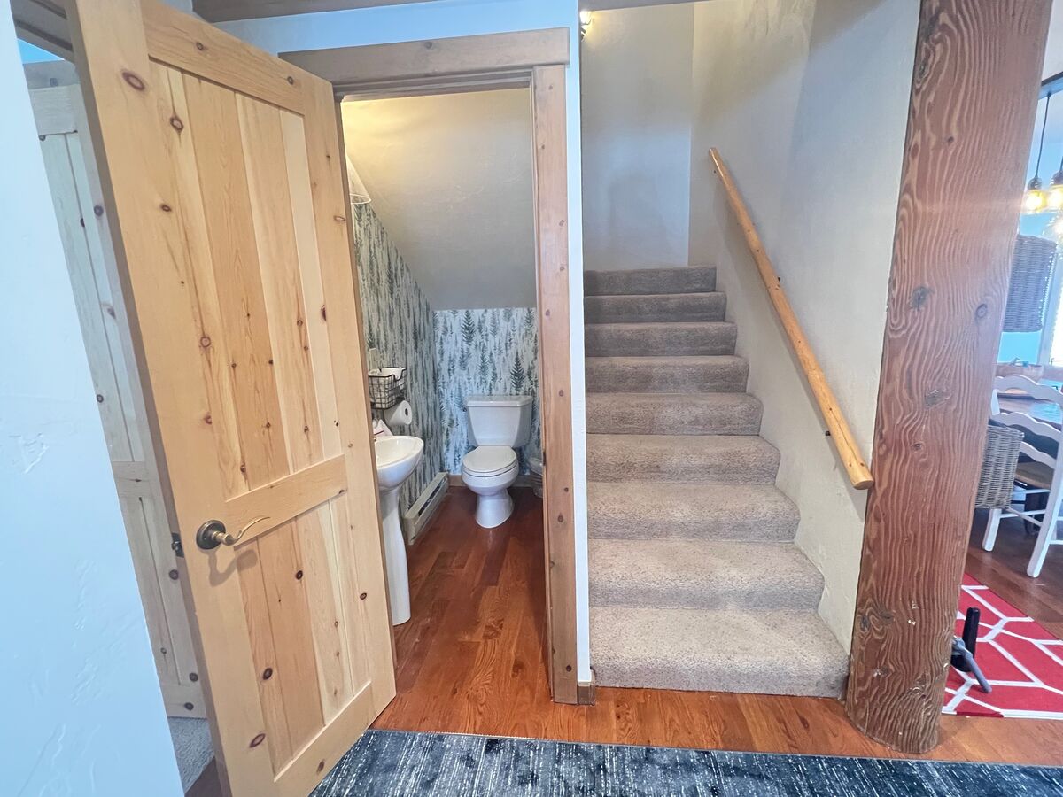 Guest bathroom and stairs to upper loft level